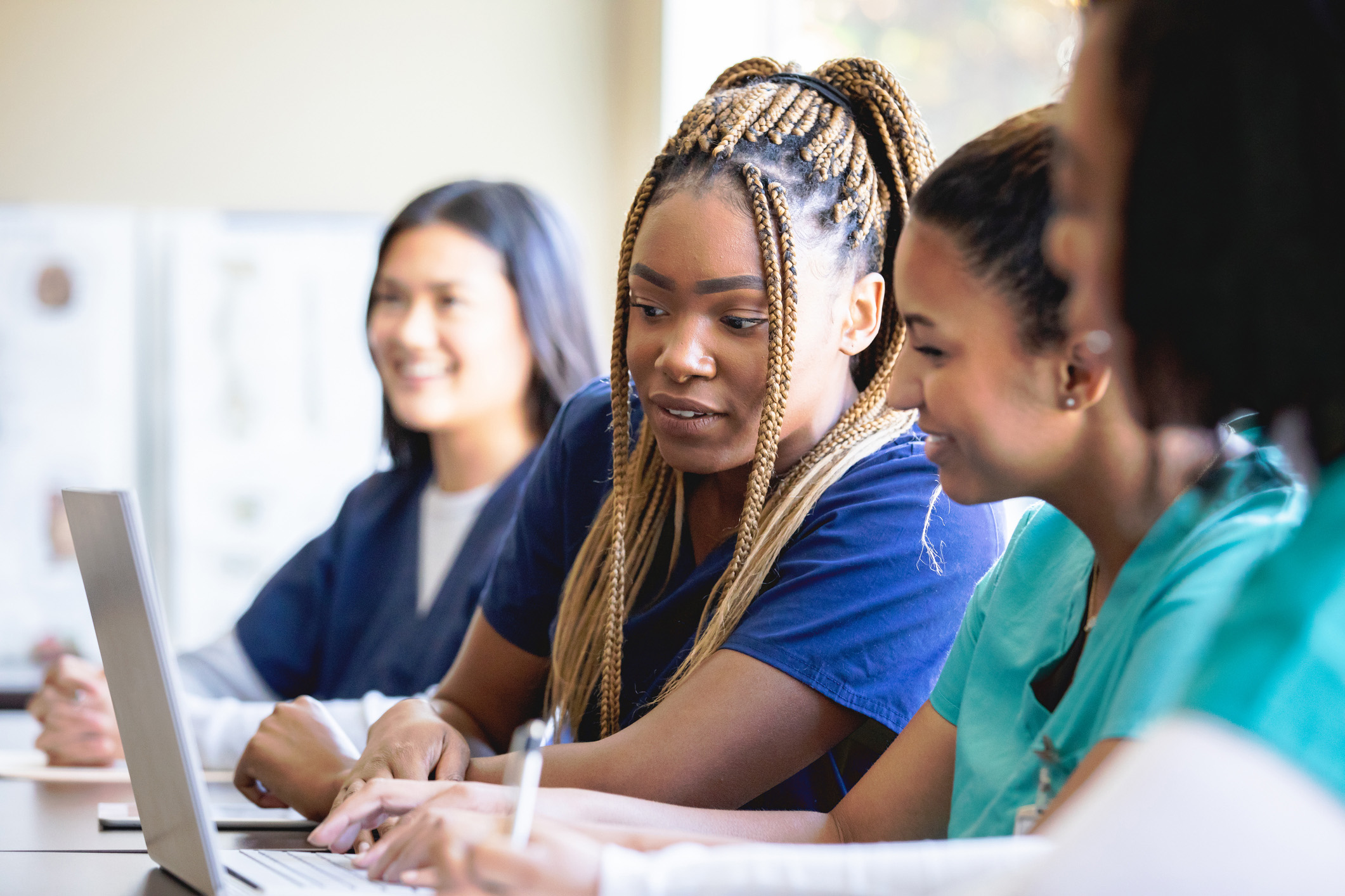 Medical Assisting students in a classroom working together